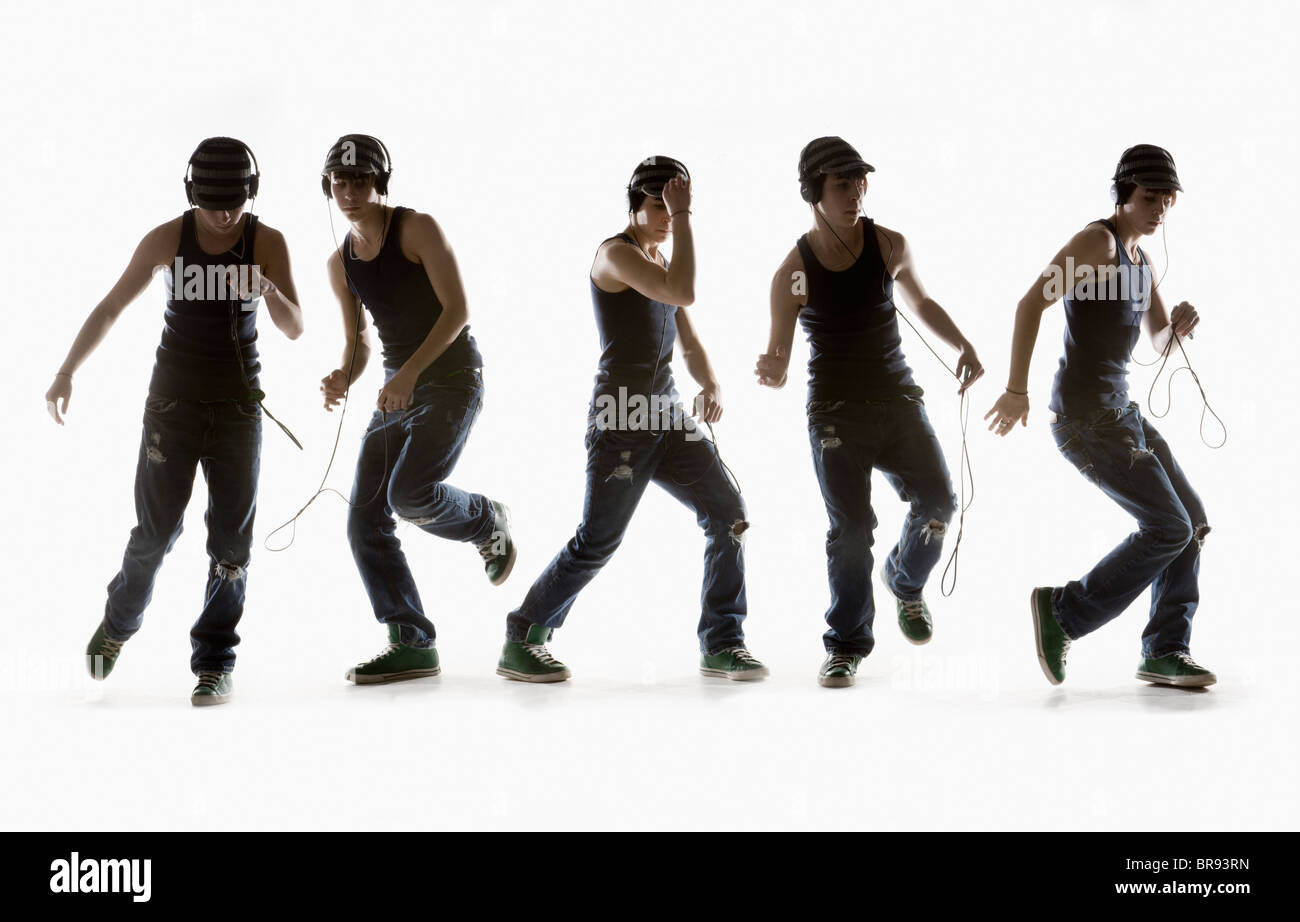 Zusammengesetztes Bild eines jungen tanzen mit Kopfhörer; Edmonton, Alberta, Kanada Stockfoto