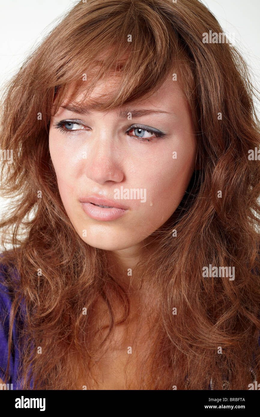 Schöne Mädchen weint über weißen isoliert Stockfoto