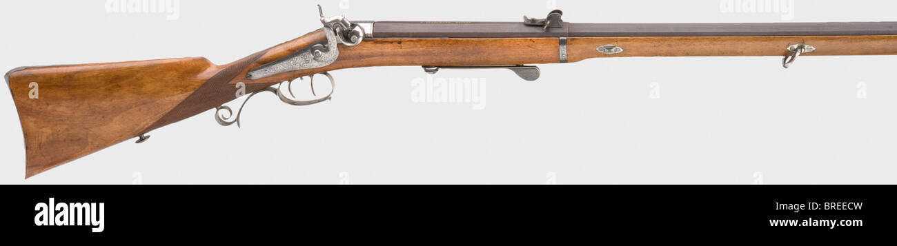 Ein seltenes Einzelschussgewehr, G. Gressmann, Deutschland, um 1870. Achteckiges Fass mit geflohener Bohrung im Kaliber 10 mm. Das Breechende des Fasses kann nach oben geneigt werden, auf der Oberseite mit "G. Gressmann. Patent". Schlagwerk-Back-Action-Sperre mit im Zaun integriertem Zerstinkmechanismus. Trigger einstellen. Walnuss-Vollmaterial mit Eisenmöbel, Auslöseschutz, Zang und Bodenhebel eingraviert und poliert. Lichtmarkierungen. Länge 113 cm. Interessante Waffe mit außergewöhnlichem System und dem äußeren Aussehen eines Schlaggewehrs. Erwerbsscheipflichtig. Historisch, histor, Stockfoto