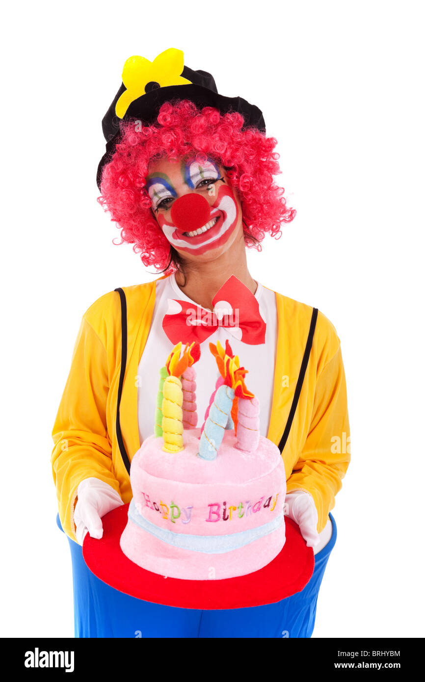 lustiger Clown hält einen Geburtstag Kuchen Hut (isoliert auf weiss) Stockfoto