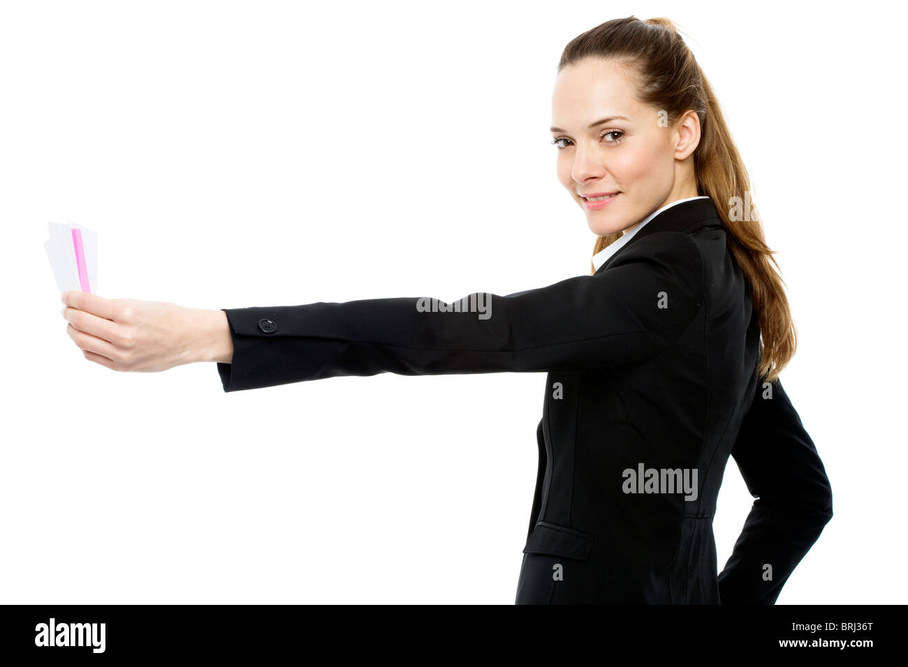 Junge Geschäftsfrau Dokumente zurückzuhalten Stockfoto