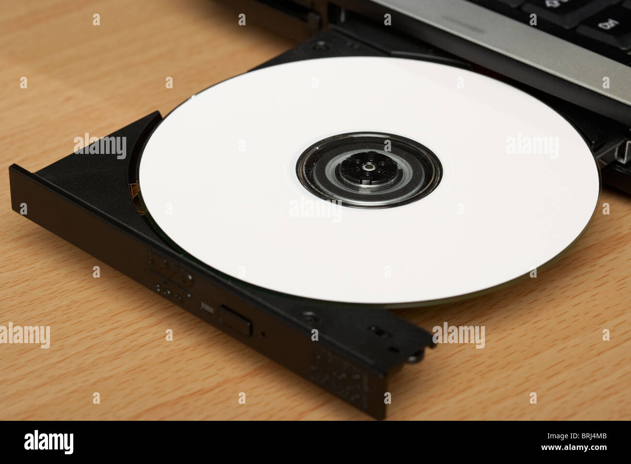 weiße cd in Laptop-cd-dvd-Fach Stockfoto