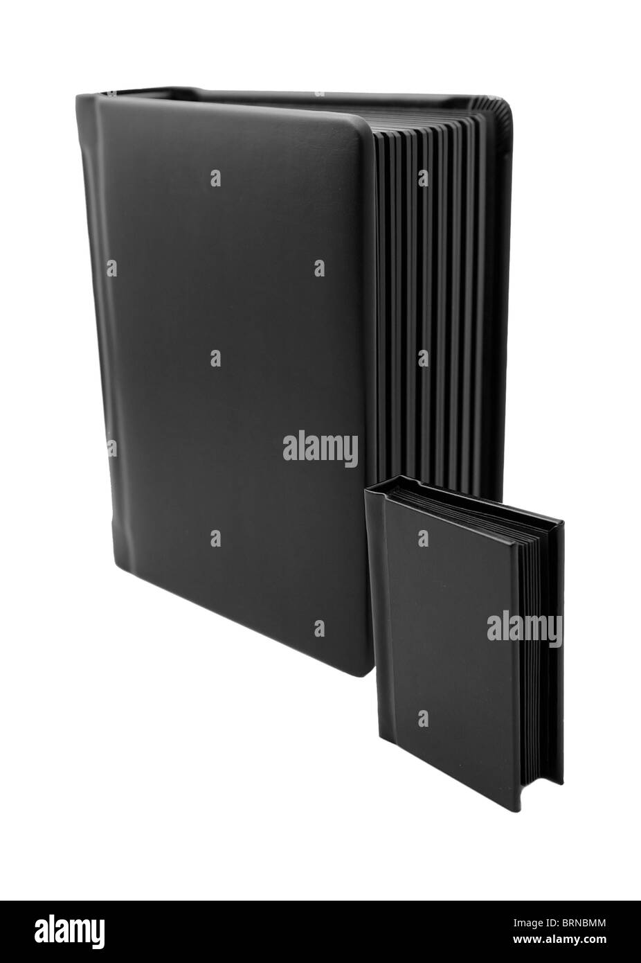 eine große und eine kleine schwarze passende Bücher Stockfoto