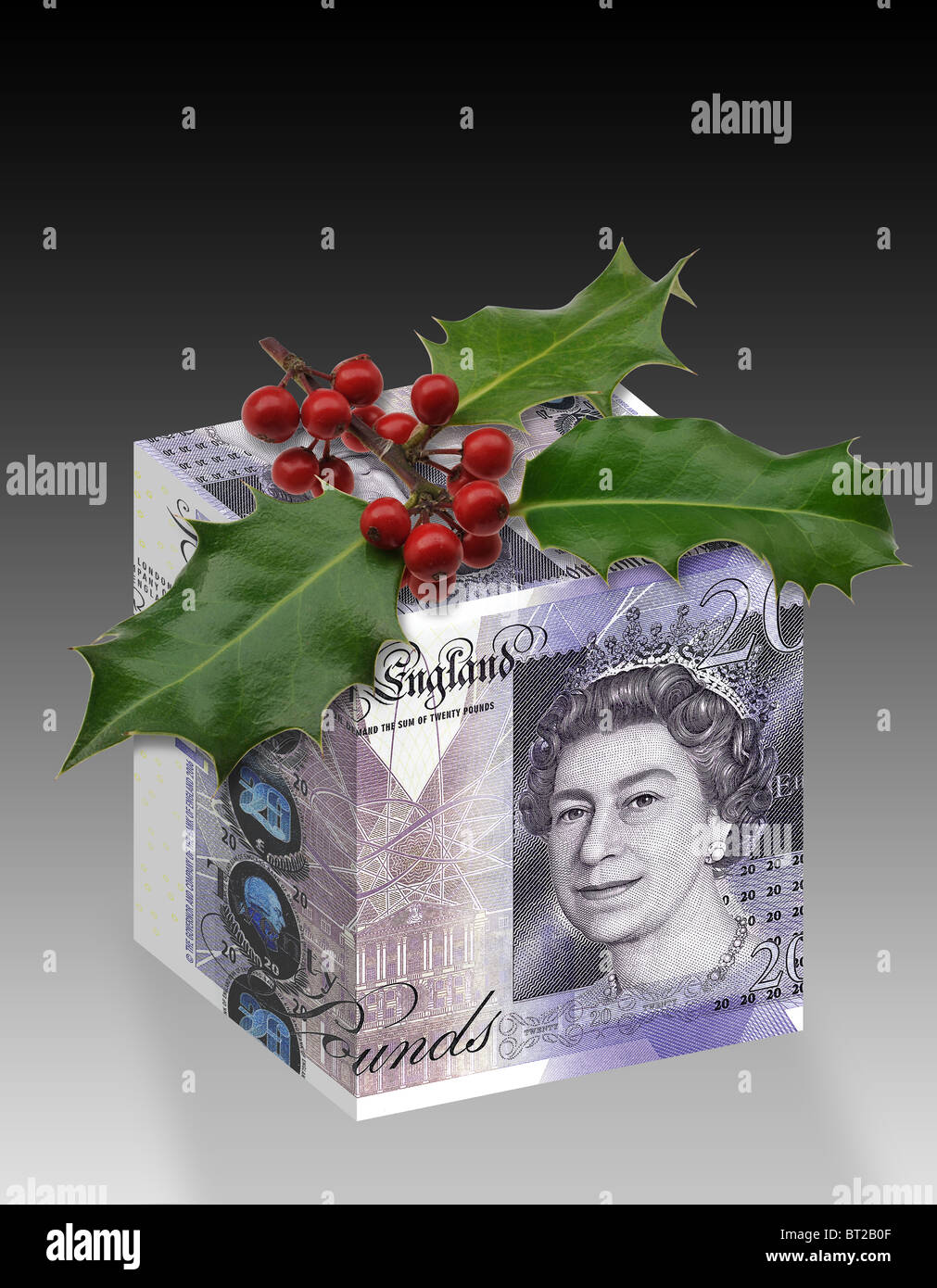 UK Sterling-Geld-Geschenk-Box eingepackt mit £20 zwanzig Pfund-Noten mit Weihnachten Holly an der Spitze. Stockfoto