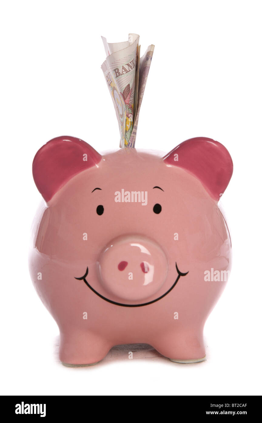 Sparschwein mit zehn Pfund Sterling Studio Ausschnitt Stockfoto