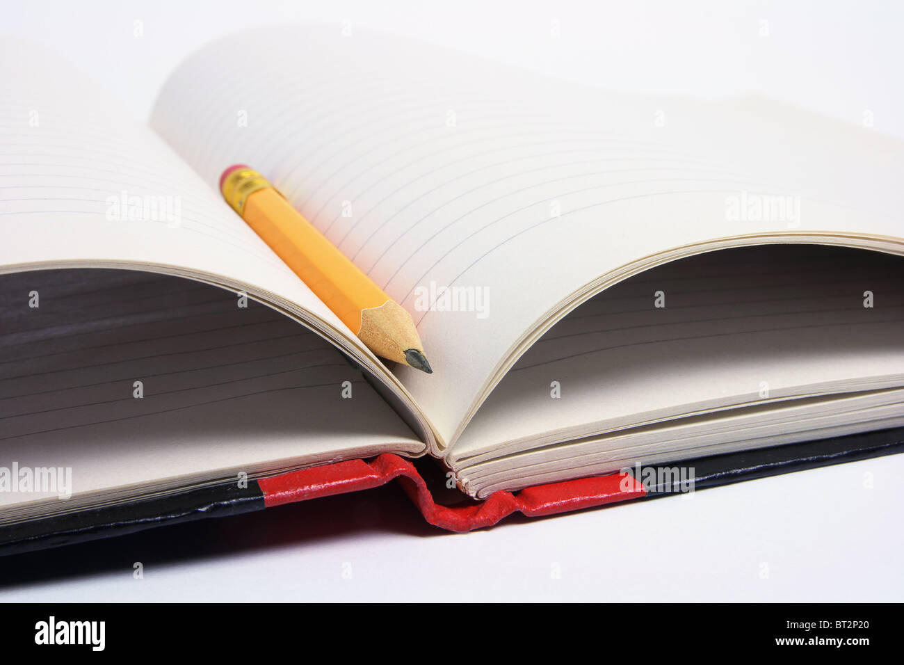 Bleistift und Notizbuch Stockfoto