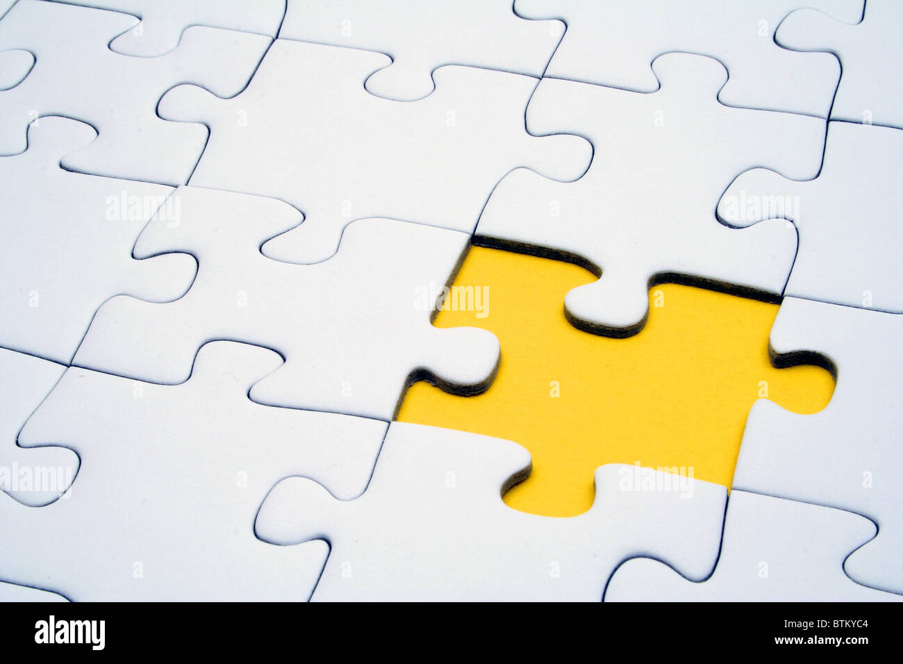 Ein Puzzle-Spiel mit einem fehlenden Stück. Stockfoto