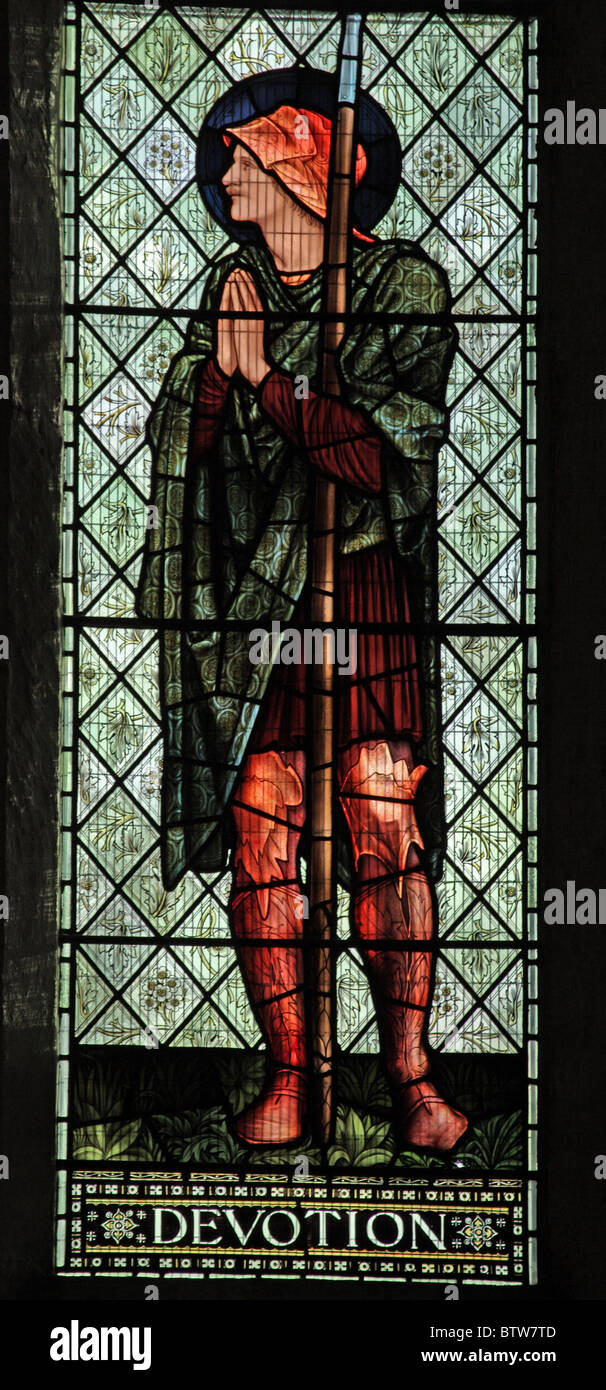 Ein Glasfenster von Edward Burne-Jones Darstellung Hingabe, Malmesbury Abbey, Wiltshire Stockfoto