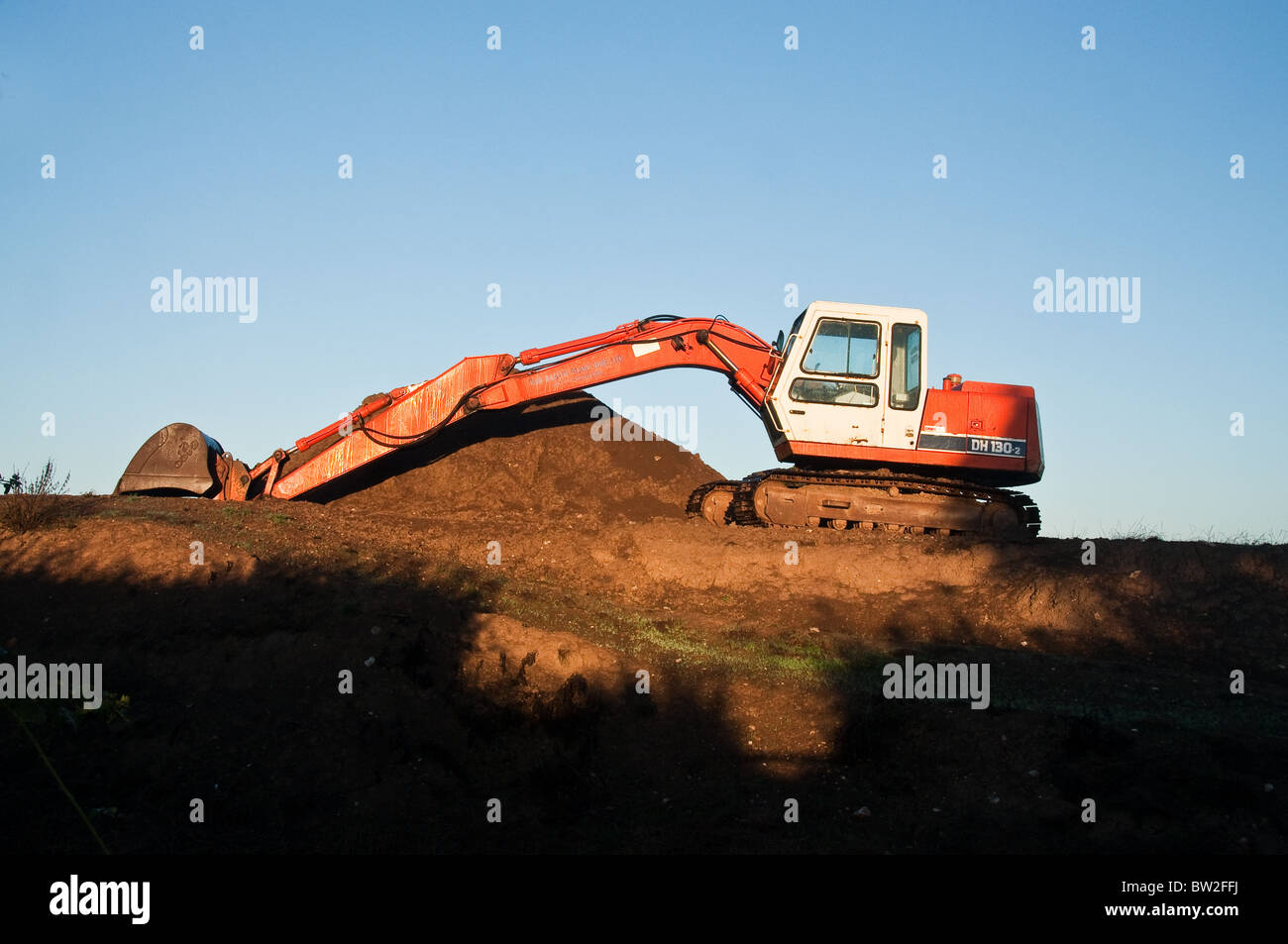 Mechanische Digger im Sonnenlicht Stockfoto