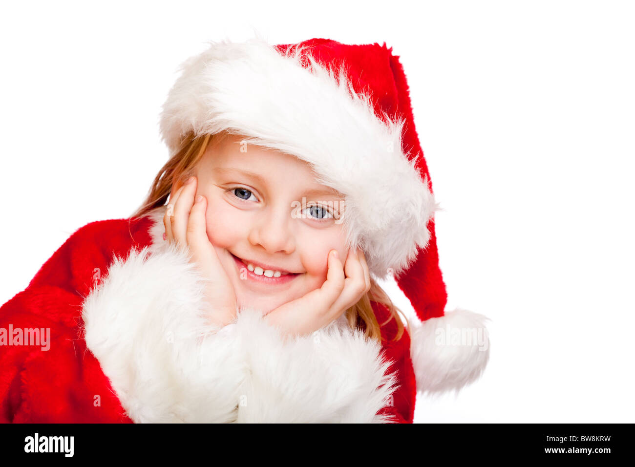 Kleines Mädchen verkleidet als Weihnachtsmann lächelt glücklich.  Isoliert auf weißem Hintergrund. Stockfoto