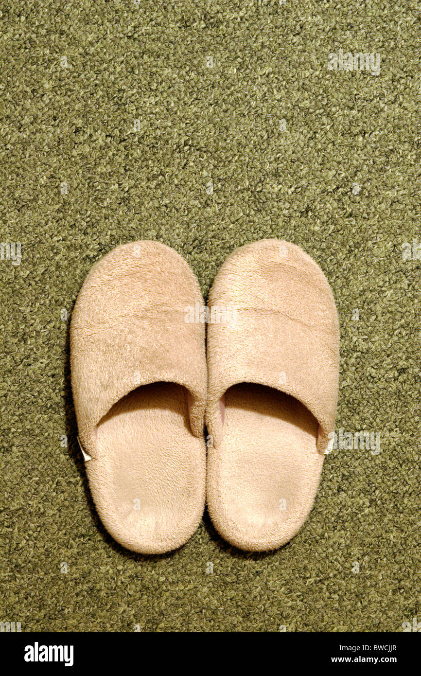 Pantoffeln auf Teppich Stockfoto