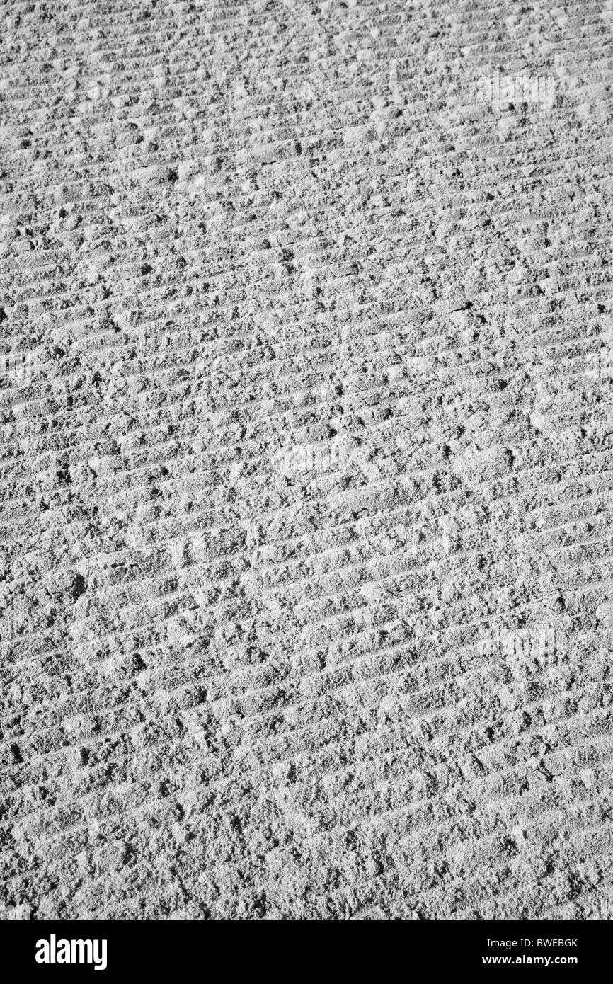 Muster in einem sandigen Strand abstrakt (monochrom) Stockfoto