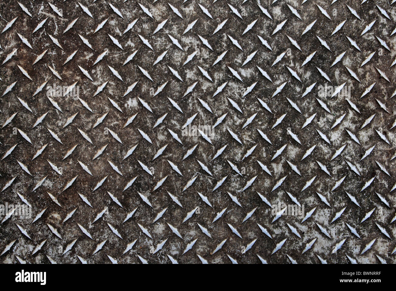 schmutzige alte Aluminium Diamant Platte rutschfeste Oberfläche Hintergrund getragen Stockfoto