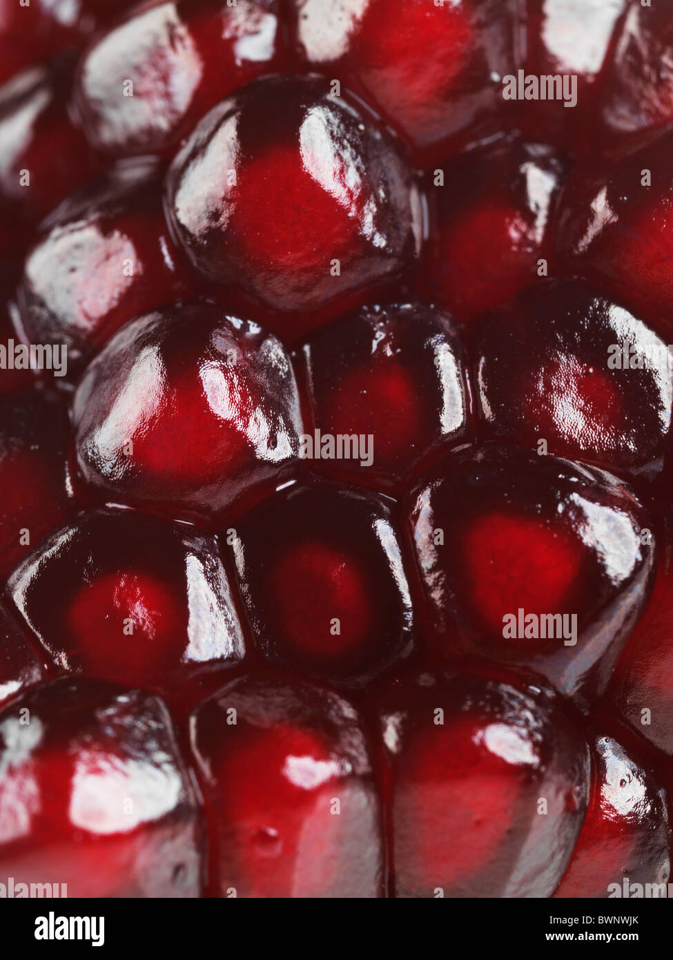 Nahaufnahme der rote Granatapfel Arils Textur Hintergrund Stockfoto