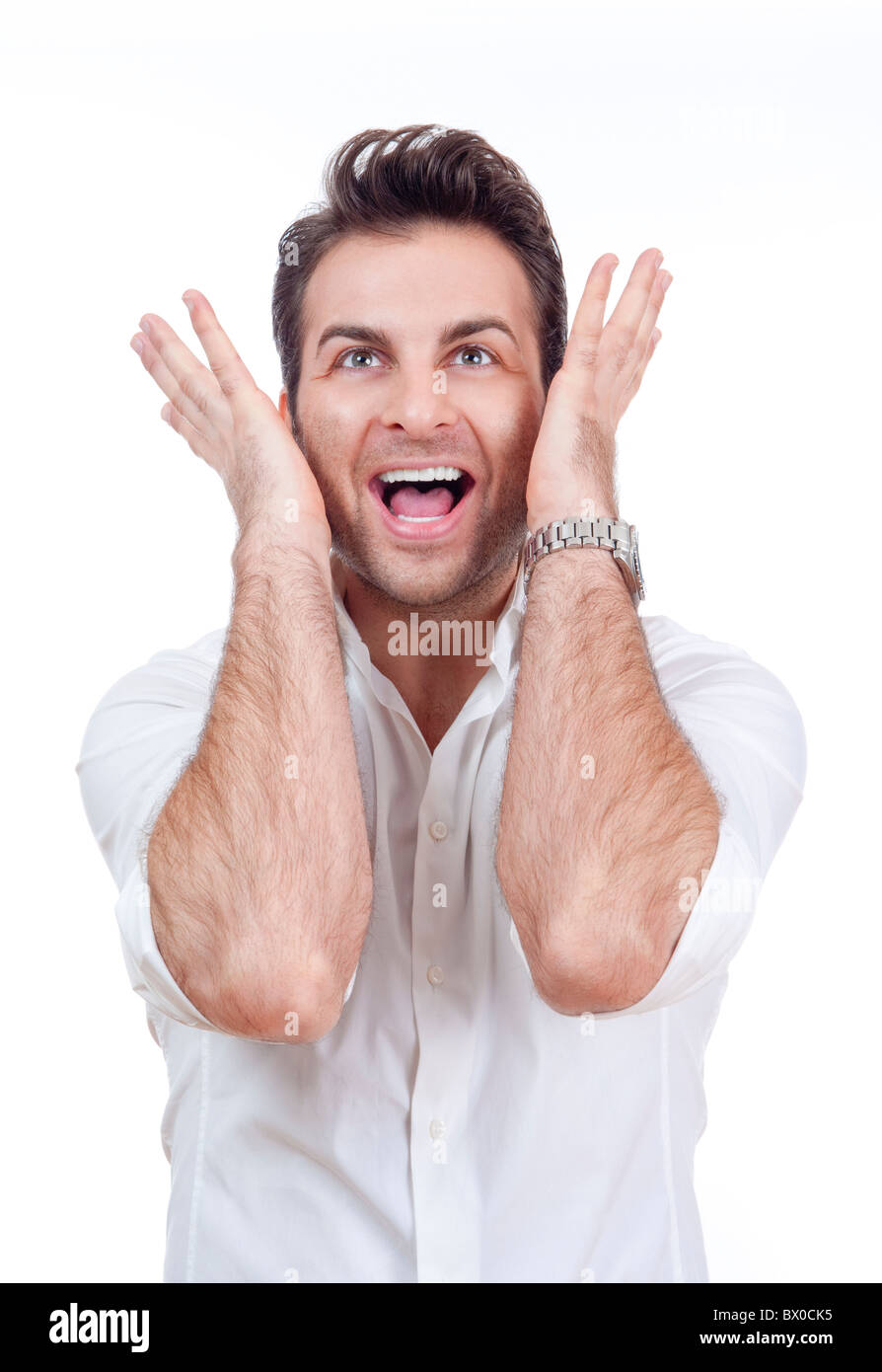 aufgeregt Mann im Hemd mit beiden Armen auf der Suche nach überrascht - isoliert auf weiß Stockfoto