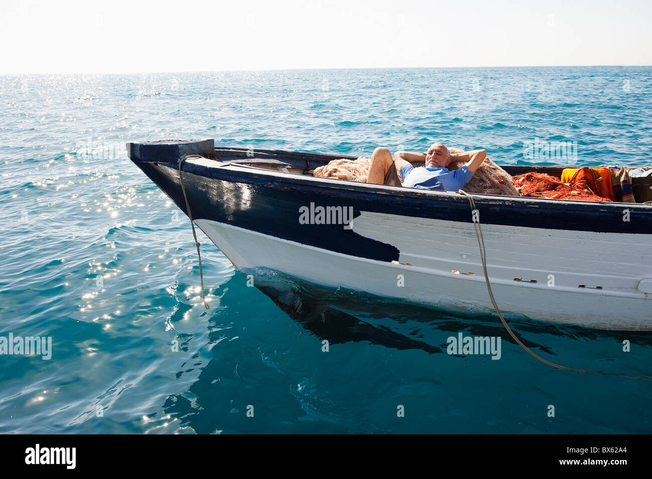 Fischer schlafend auf Netze Stockfoto
