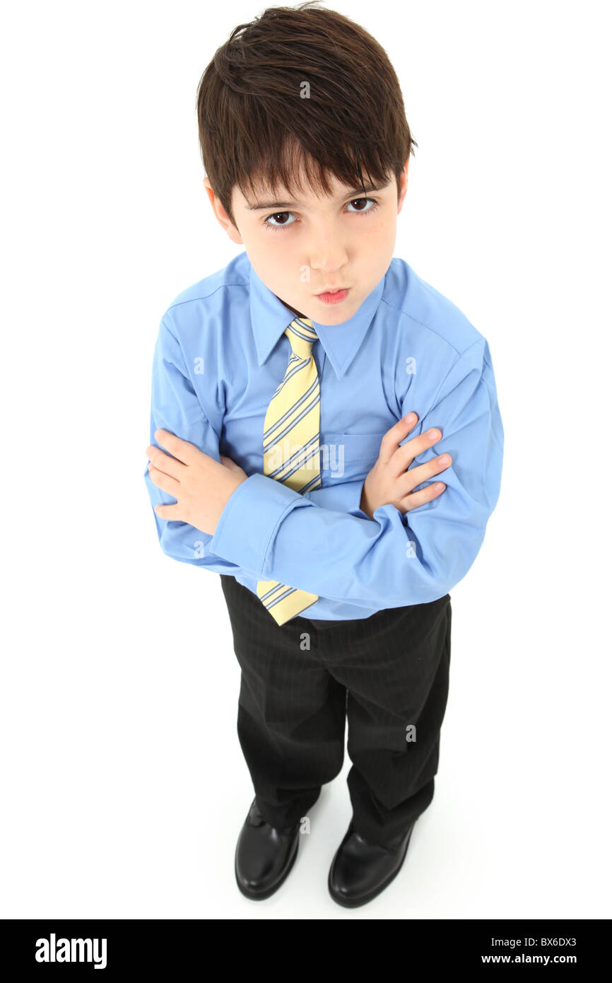 Adorable sieben Jahre alte französische amerikanischen junge in Hosen, Hemd  und Krawatte auf weißem Hintergrund Stockfotografie - Alamy