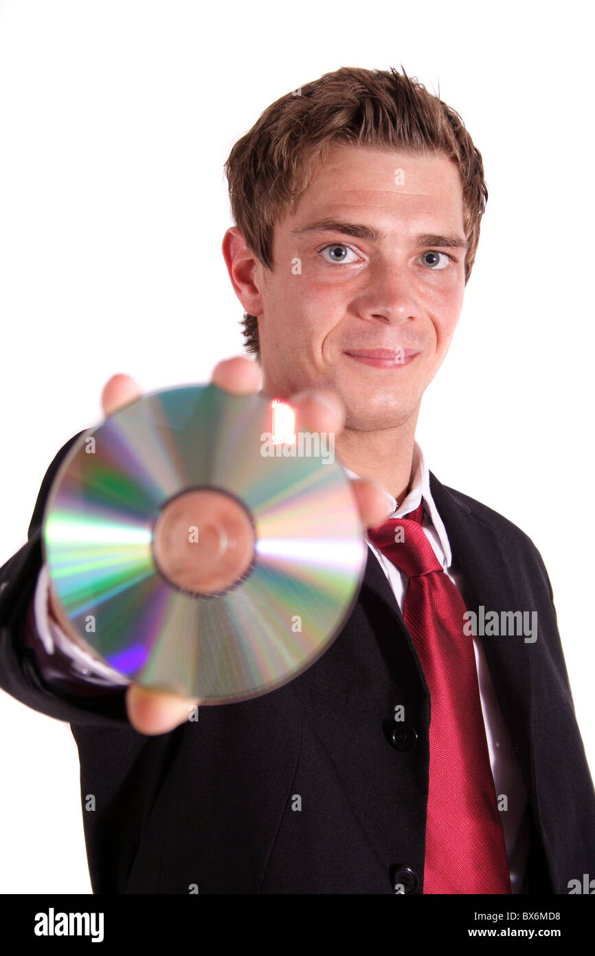 Schmerzenden Geschäftsmann hält eine cd oder dvd. Alle isoliert auf weißem Hintergrund. Stockfoto