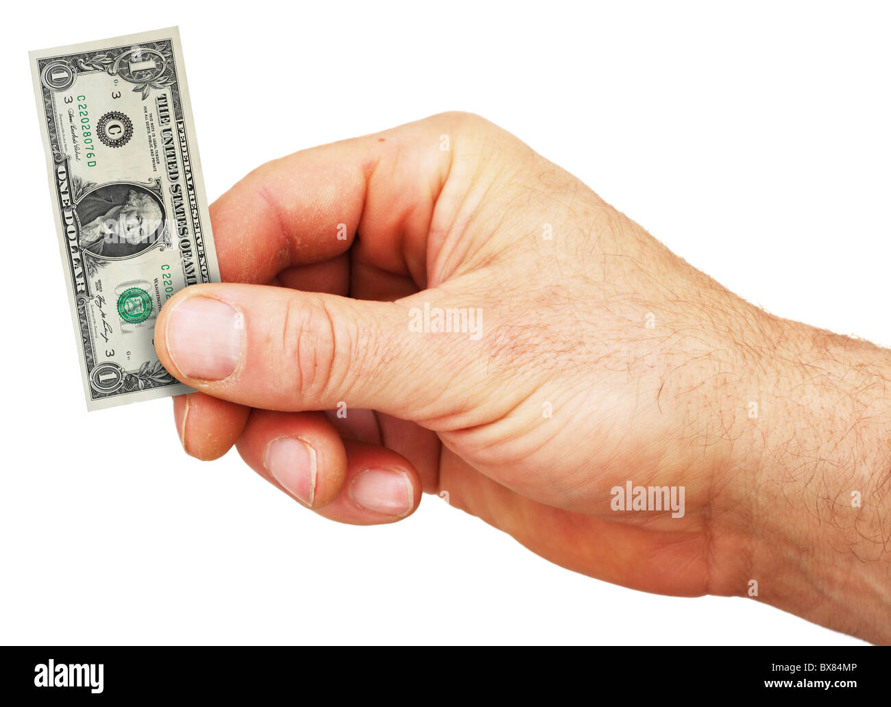eine Hand hält einen winzigen Dollarschein zeigt die Schwächung des US-Dollars aufgrund der inflation Stockfoto