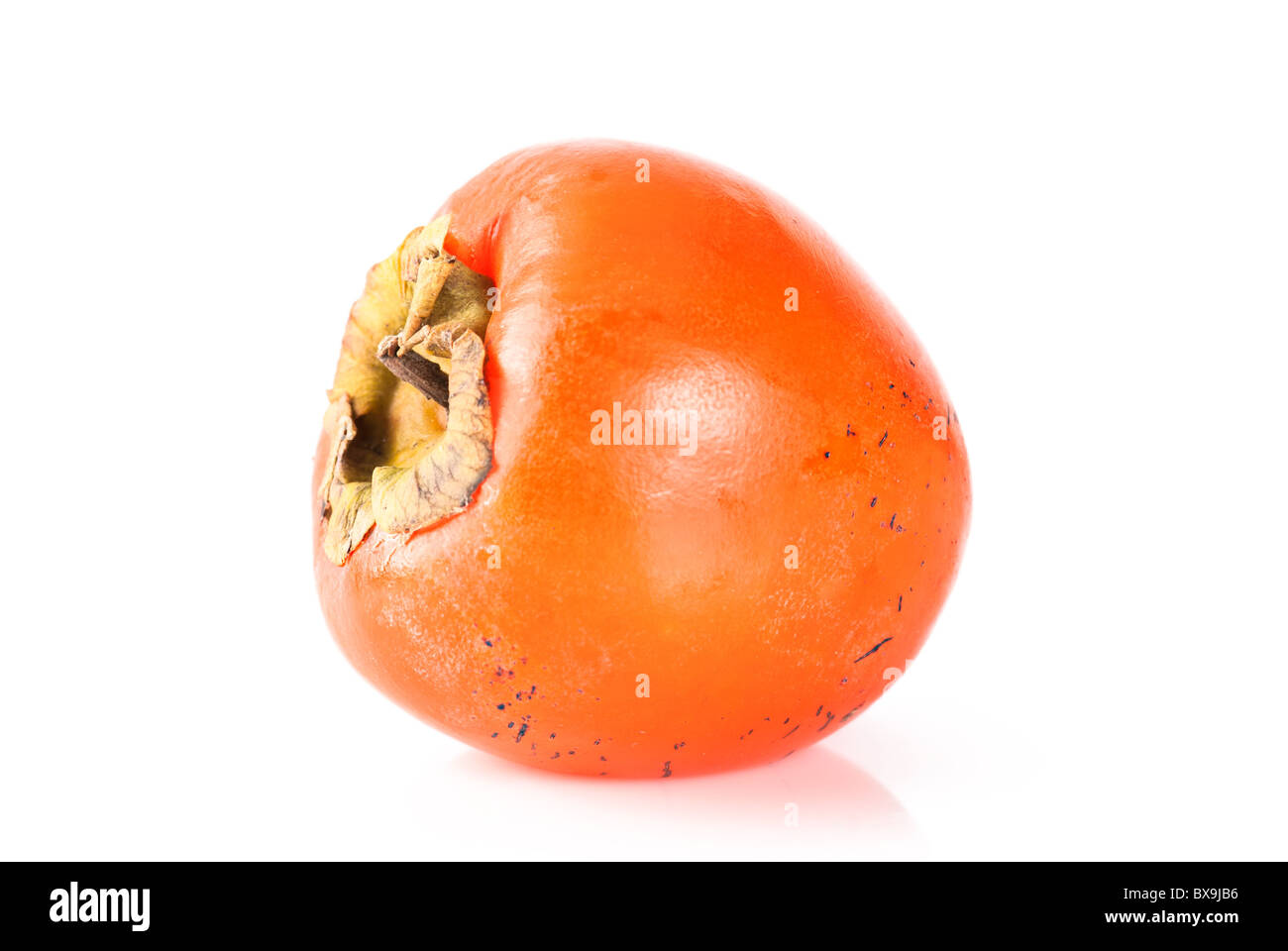 Reife orange Persimmon auf weißem Hintergrund Stockfoto