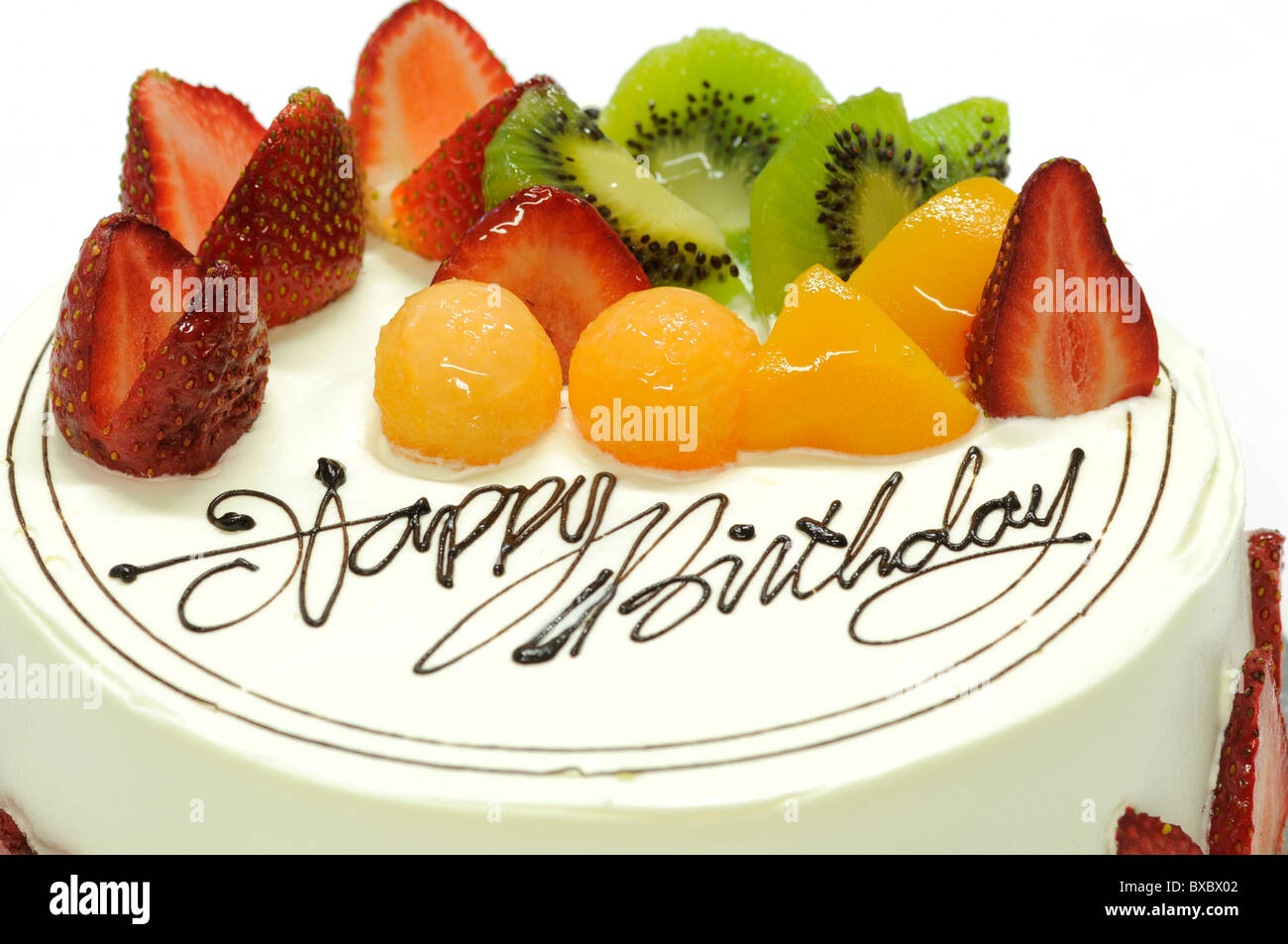 Leckere bunte Obstkuchen mit happy Birthday drauf Stockfoto