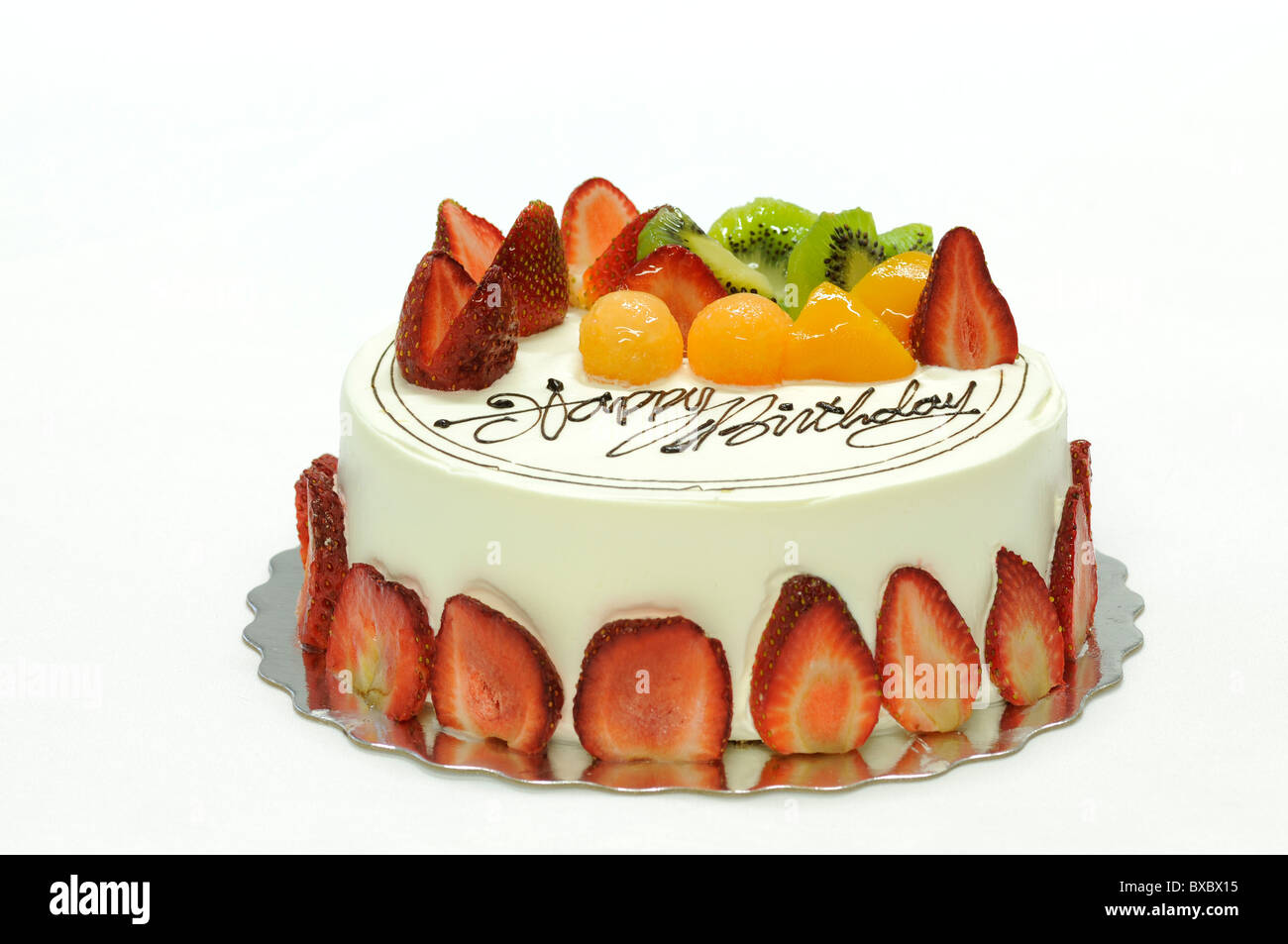 Leckere bunte Obstkuchen mit happy Birthday drauf Stockfoto