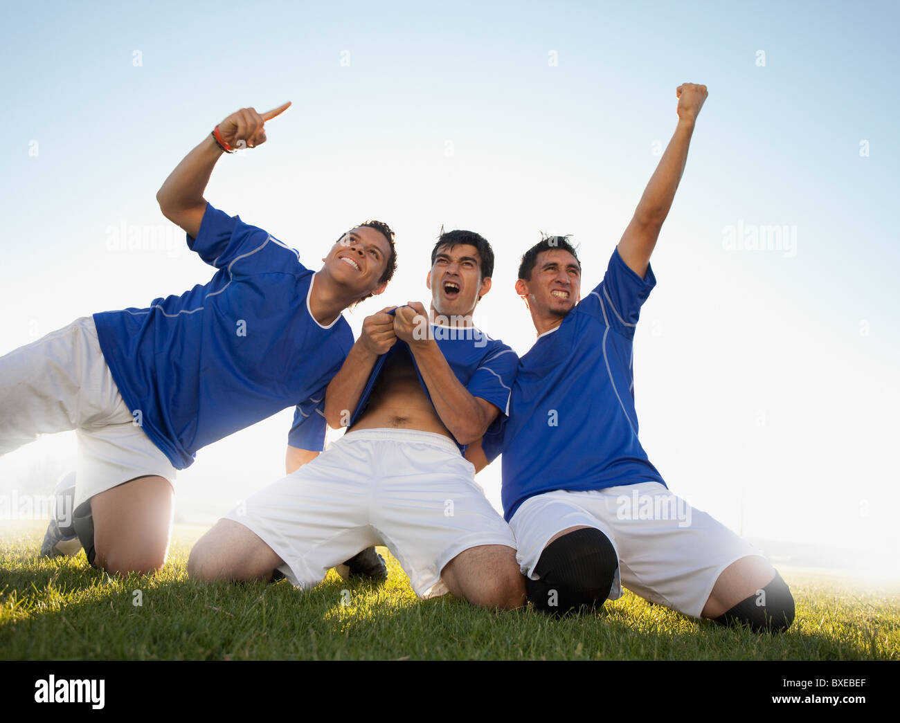 Drei glückliche Fußball-Spieler Stockfoto
