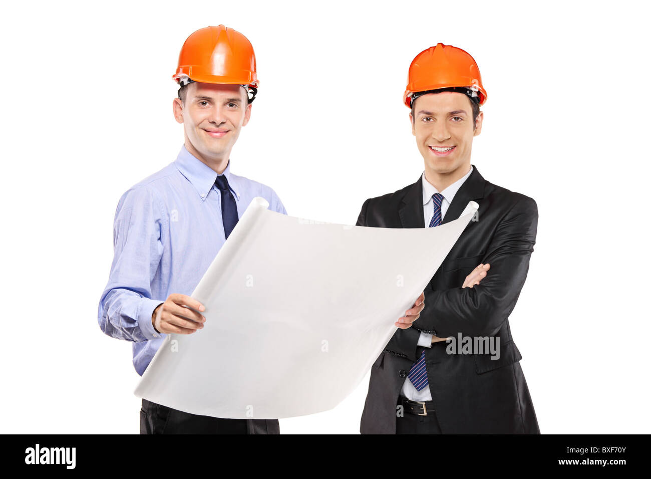 Vorarbeiter posiert mit Blaupausen Stockfoto