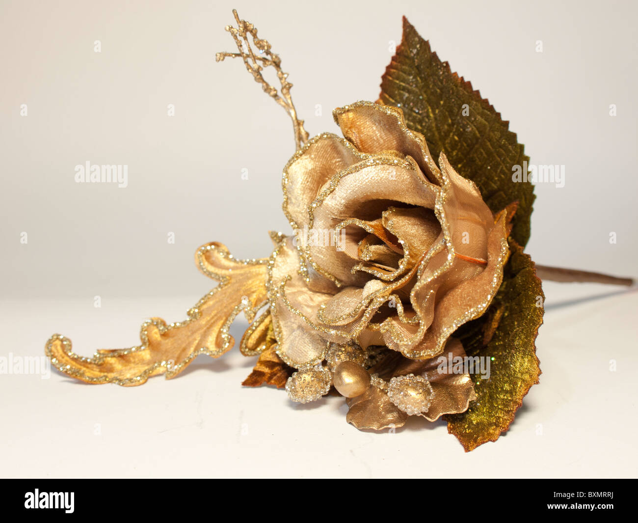 Künstliche Seide Blume gold Christrose Stockfoto