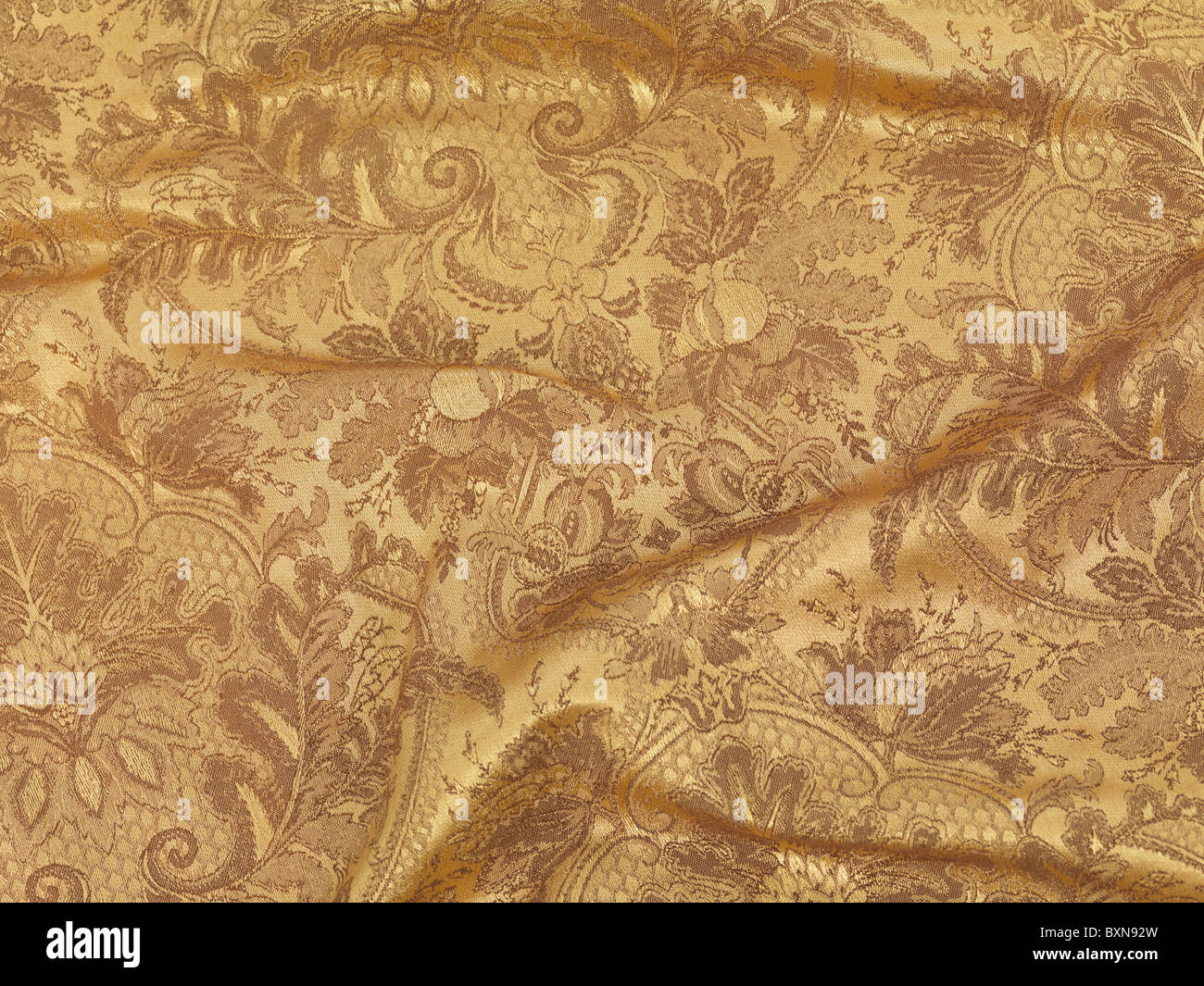 Glänzend gold Stoff Textilhintergrund Stockfoto