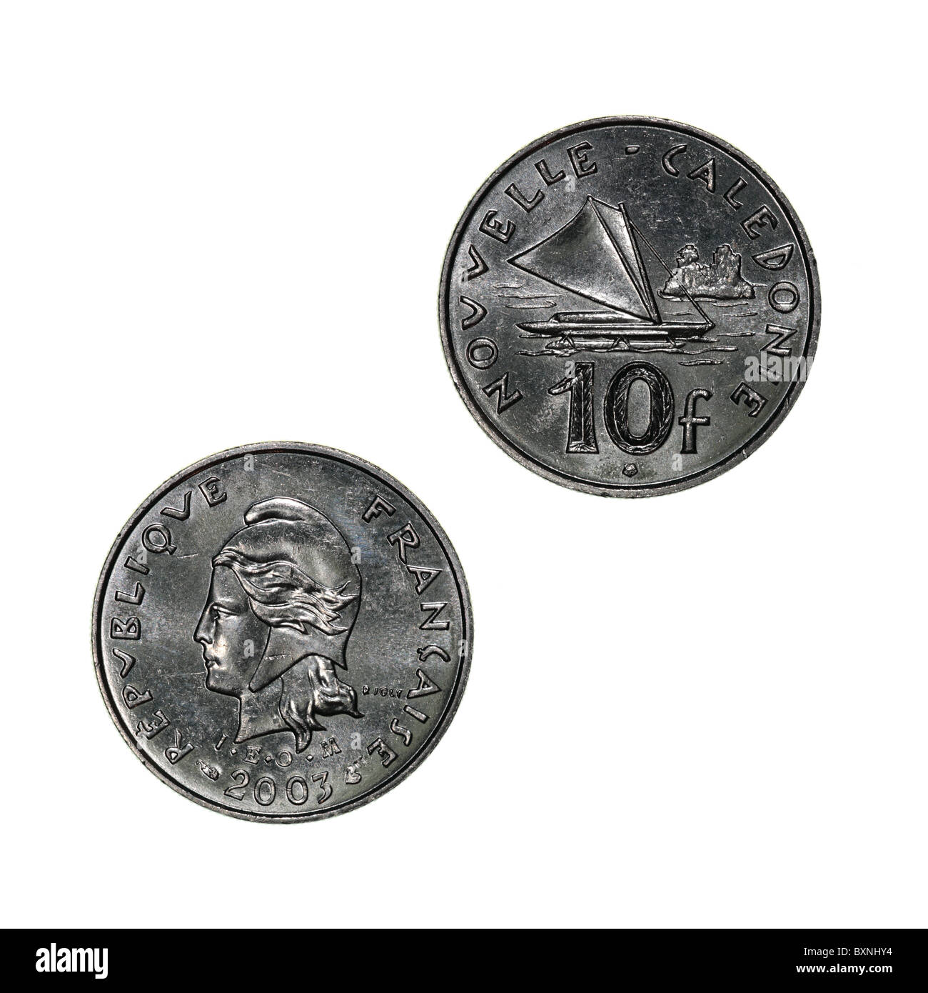 Neukaledonien - 10 Francs Münze mit Mariannekopf (obverse) und einem auslegernden Kanu mit Segelset (rückwärts) Stockfoto
