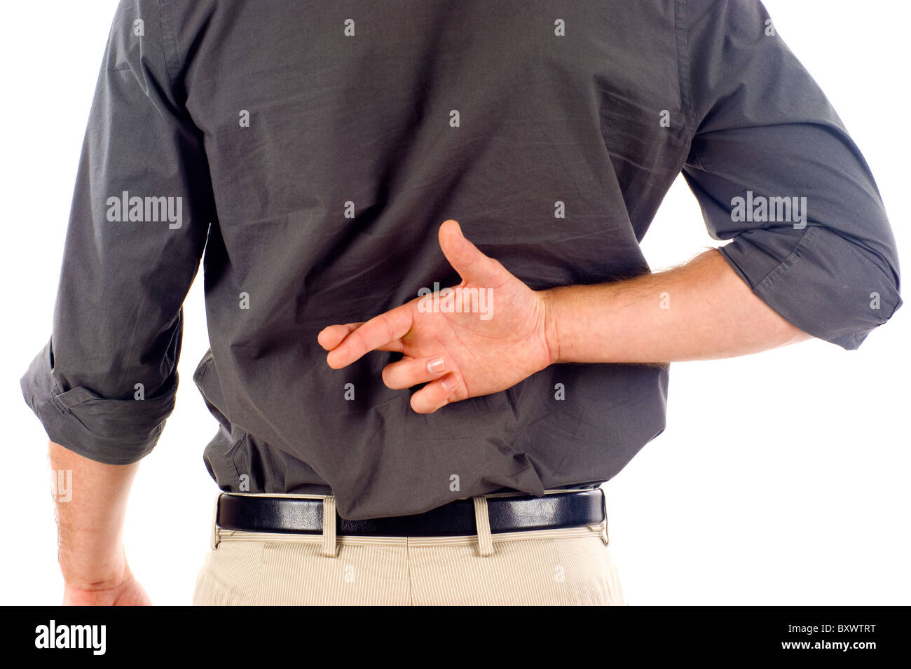 Businessmanwith kreuzte Finger hinter seinem Rücken Stockfoto