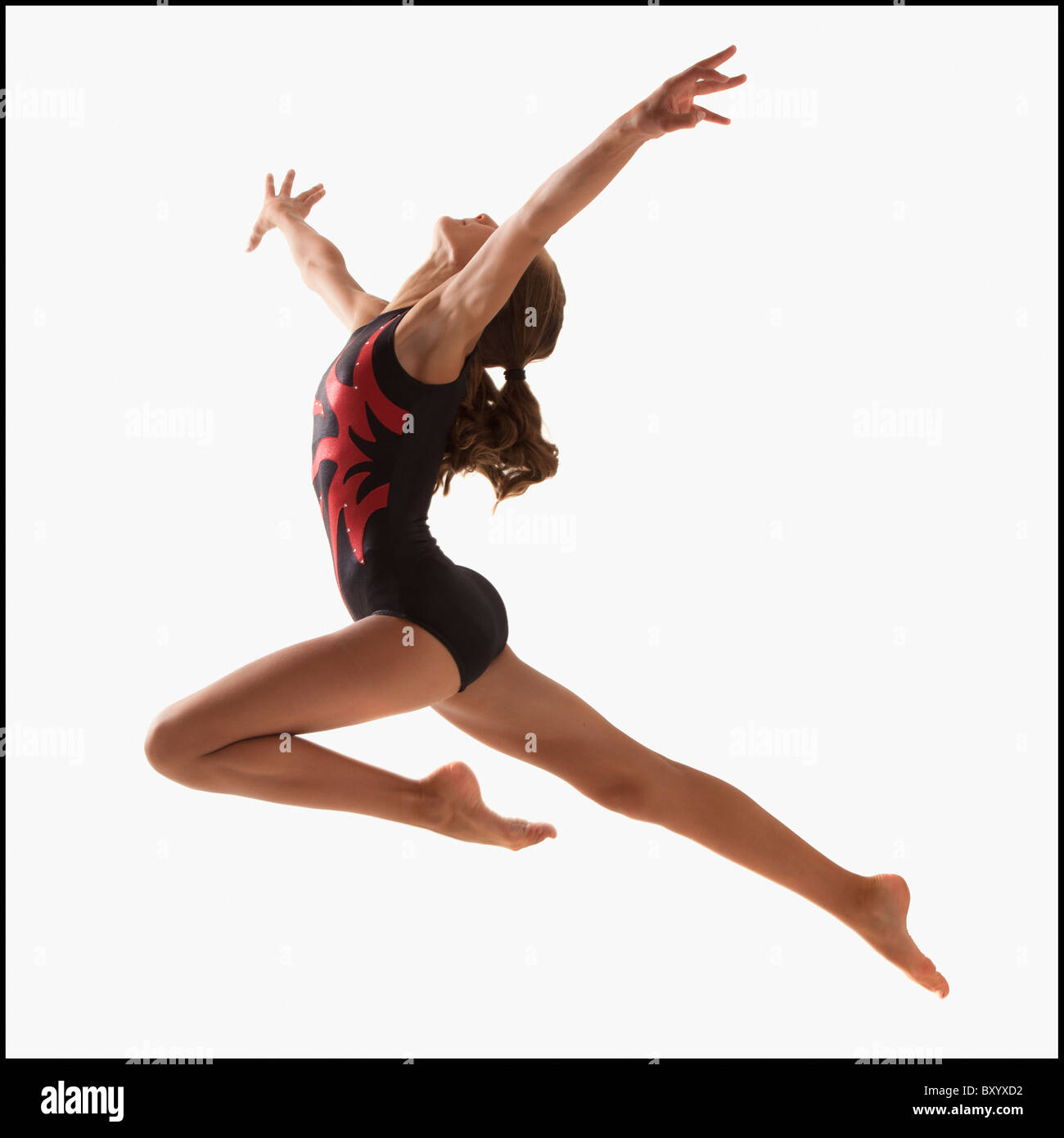 Weiblicher Gymnast springen Stockfoto