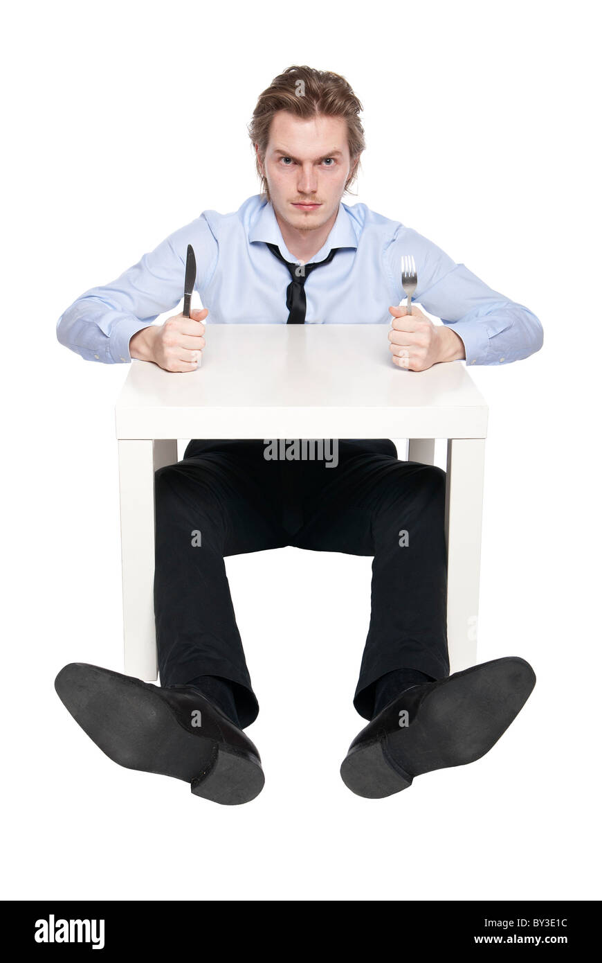Junger Mann ist hungrig. Studio Foto von hungrigen Mann, isoliert auf weiss. Stockfoto
