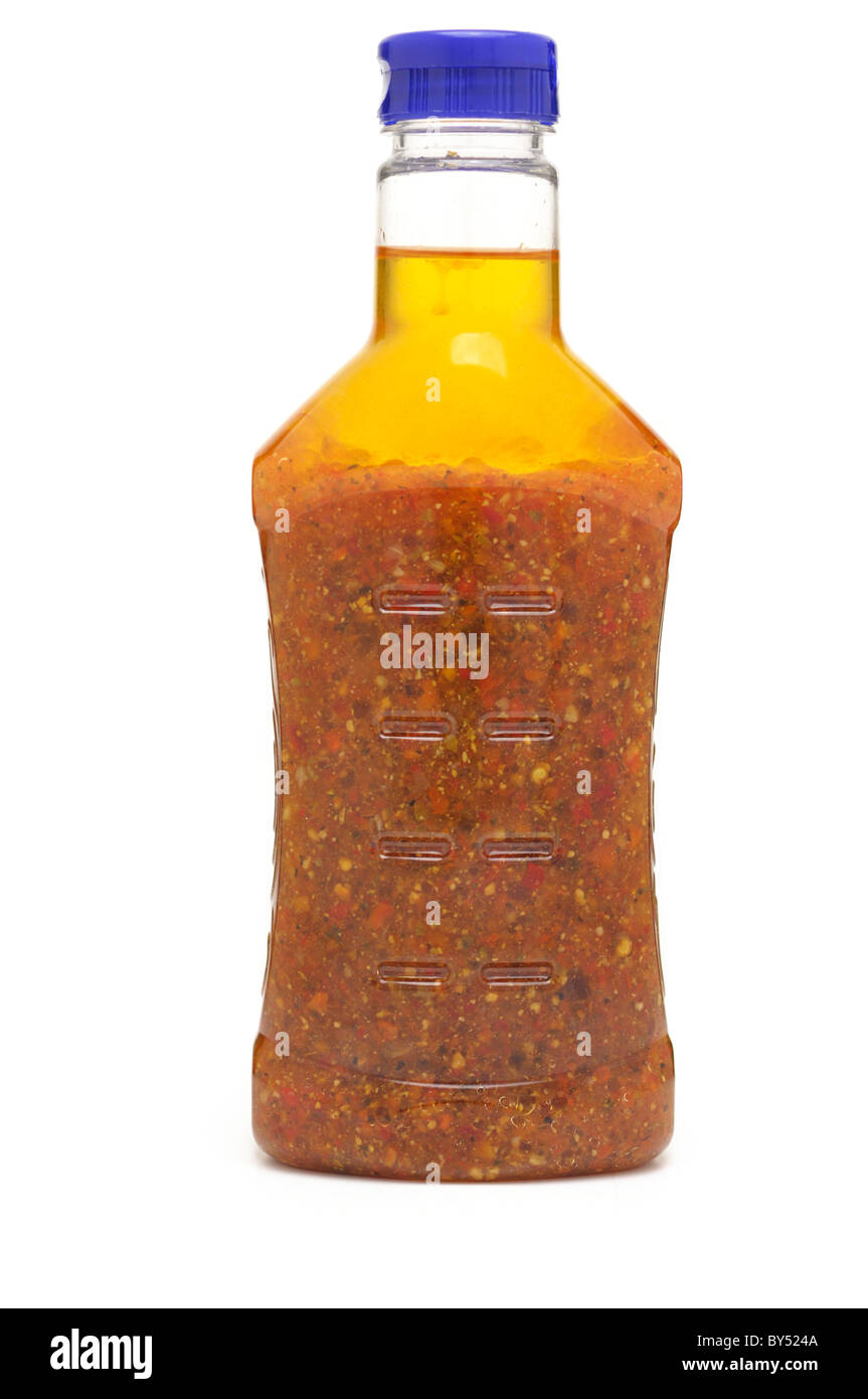 Flasche Salatdressing, sonnengetrocknete Tomaten Stockfoto
