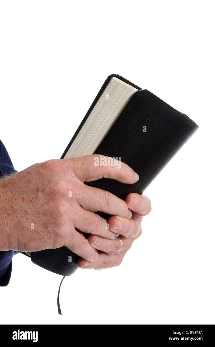 Missionarische Mannhände Kupplung Bibel. Isoliert auf weiss. Raum für Kopie an Spitze. Stockfoto