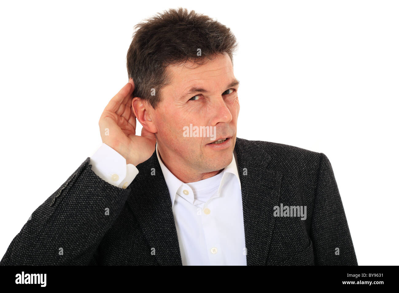 Attraktiver Mann mittleren Alters kann nicht nichts hören. Alle auf weißem Hintergrund. Stockfoto