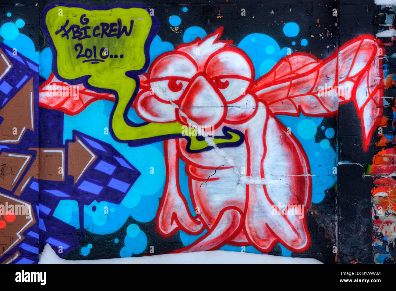 Graffiti, außerirdisches Alien, an einer Wand Stockfoto