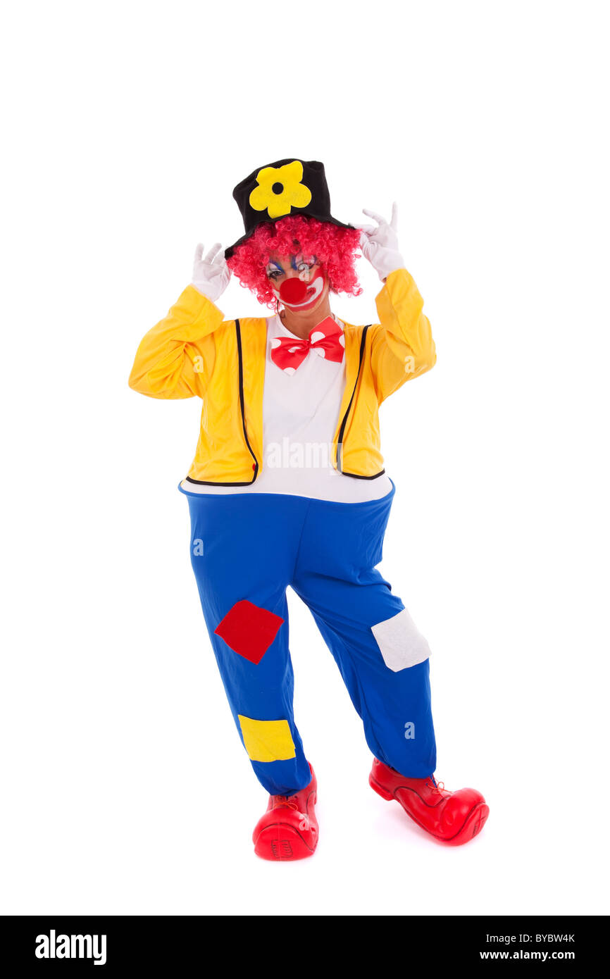 Lustiger Clown stehend auf einem weißen Hintergrund Stockfoto