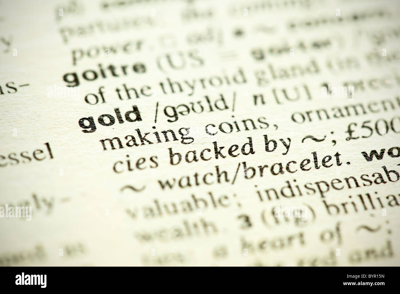 Wörterbuch-Definition des Wortes "Gold" in englischer Sprache. Flachen DOF. Stockfoto
