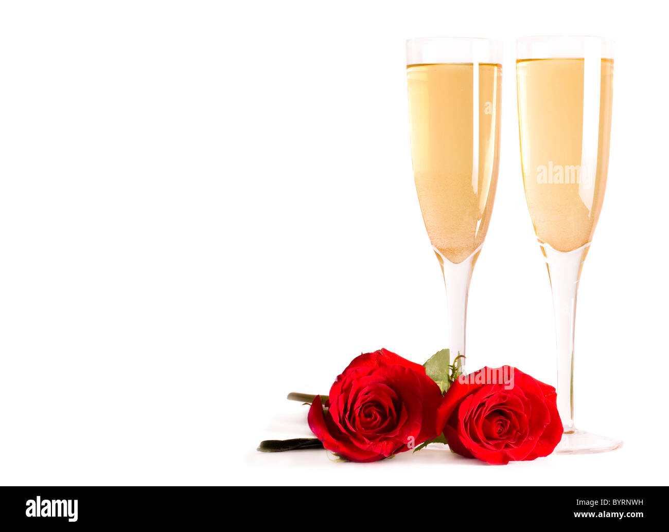 Champagner und rote Rosen Stockfoto