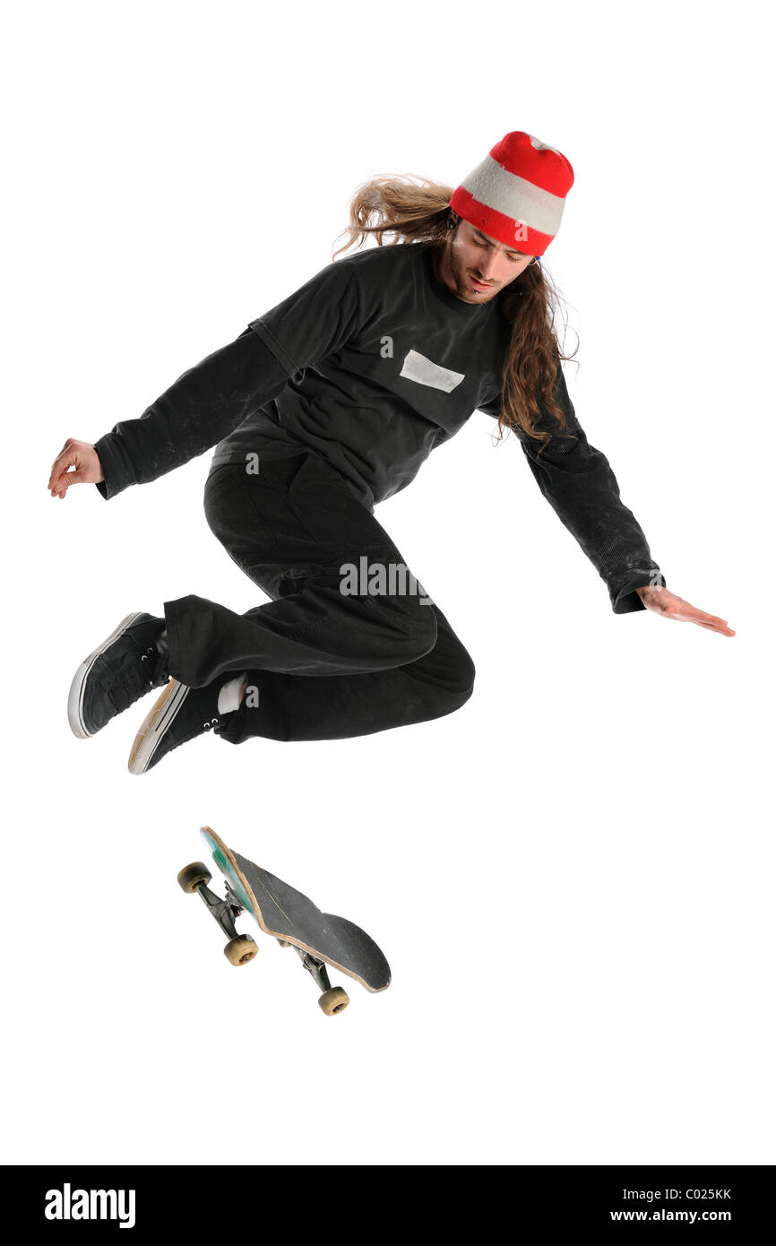 Skateboarder springen über weißen Hintergrund isoliert Stockfoto