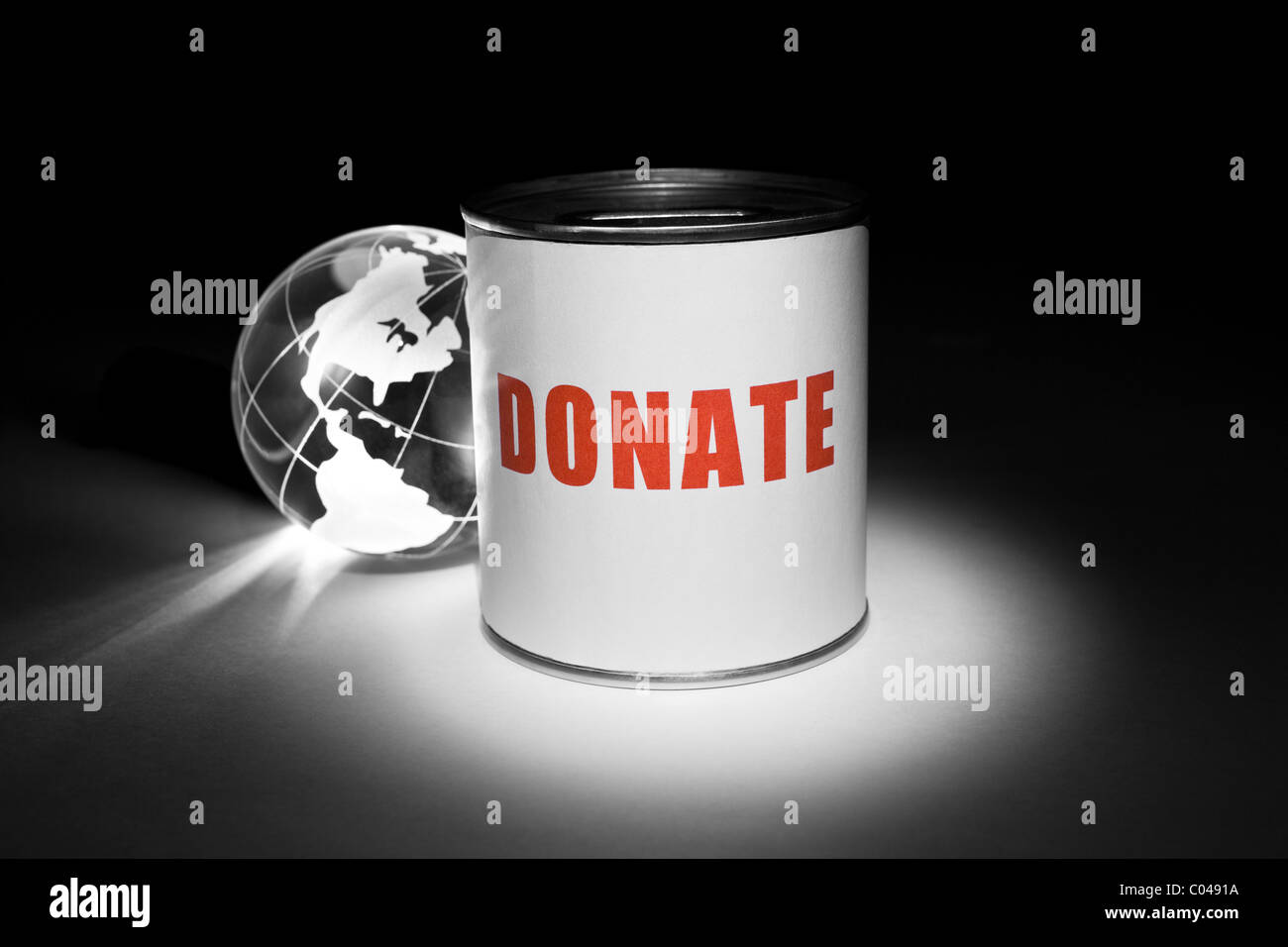 Globus und Spendenbox für Hintergrund Stockfoto