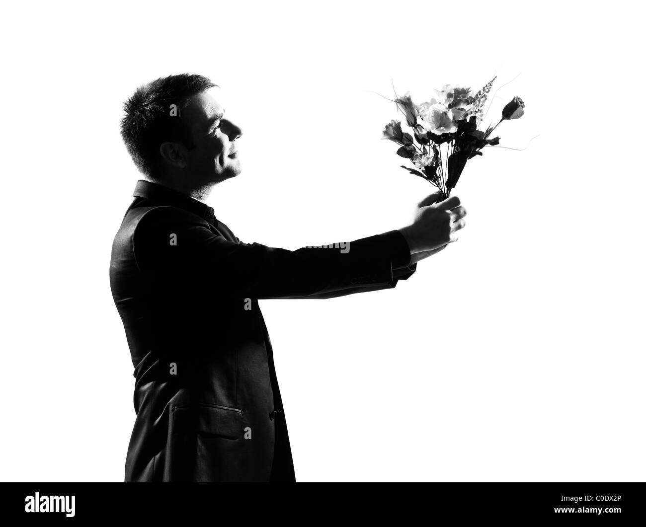 Silhouette kaukasischen Geschäftsmann Blumen ausdrücken Verhalten in voller Länge auf Studio weißen Hintergrund isoliert Stockfoto