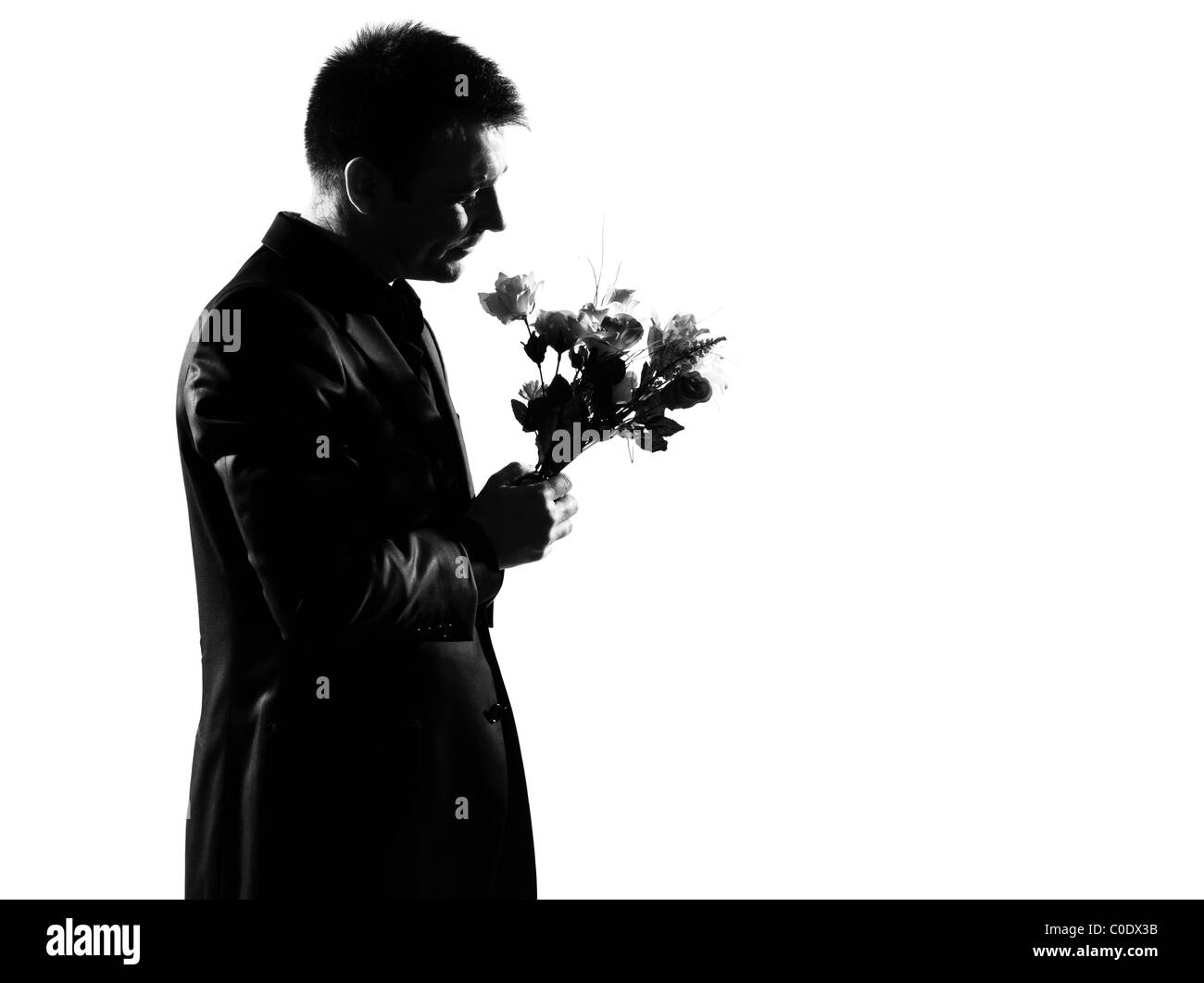 Silhouette kaukasischen Geschäftsmann Blumen ausdrücken Verhalten in voller Länge auf Studio weißen Hintergrund isoliert Stockfoto