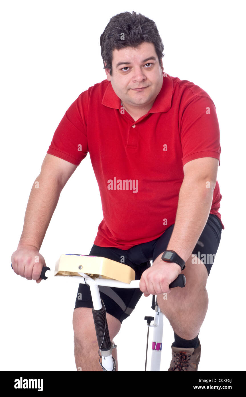 Dicker Mann dabei Training in statischen Fahrrad Stockfoto