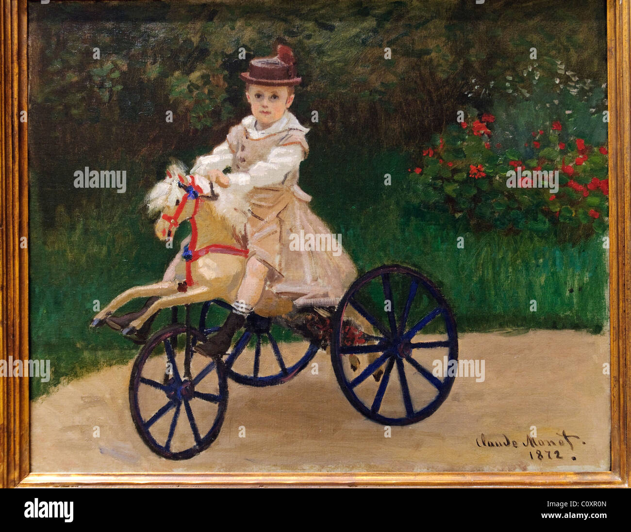 Jean Monet (1867 – 1913) auf seinem Steckenpferd, 1872, von Claude Monet, Stockfoto