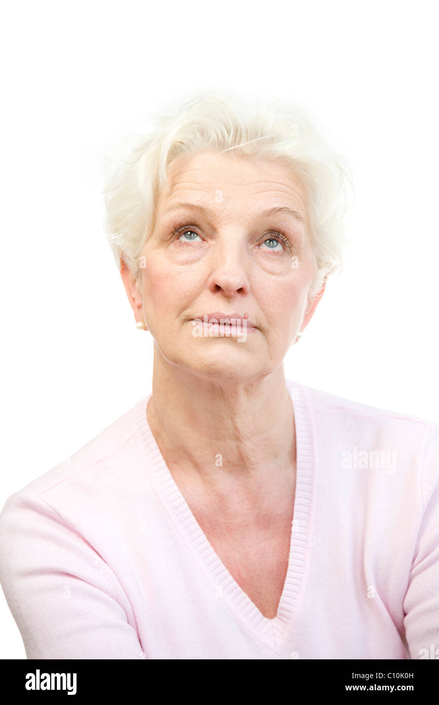 Eine gelangweilte Reife Frau rollt ihre Augen Stockfoto