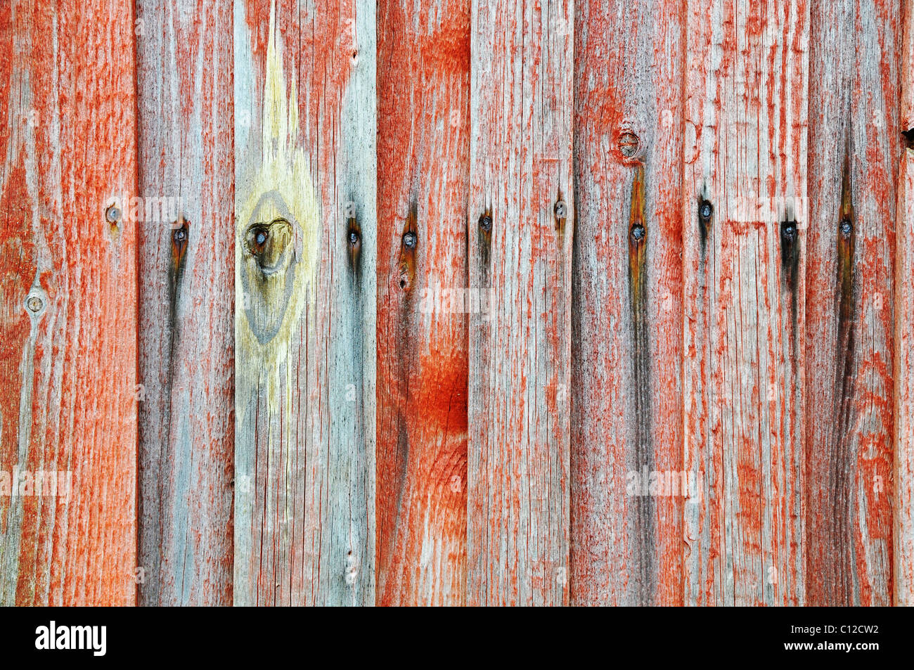 Hintergrund-Detail von einem roten und grauen Holzzaun Stockfoto