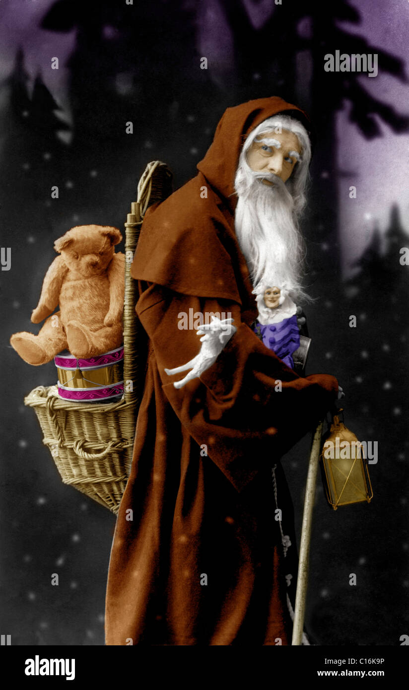 Historisches Foto, Santa Claus mit einem Teddybären Stockfoto